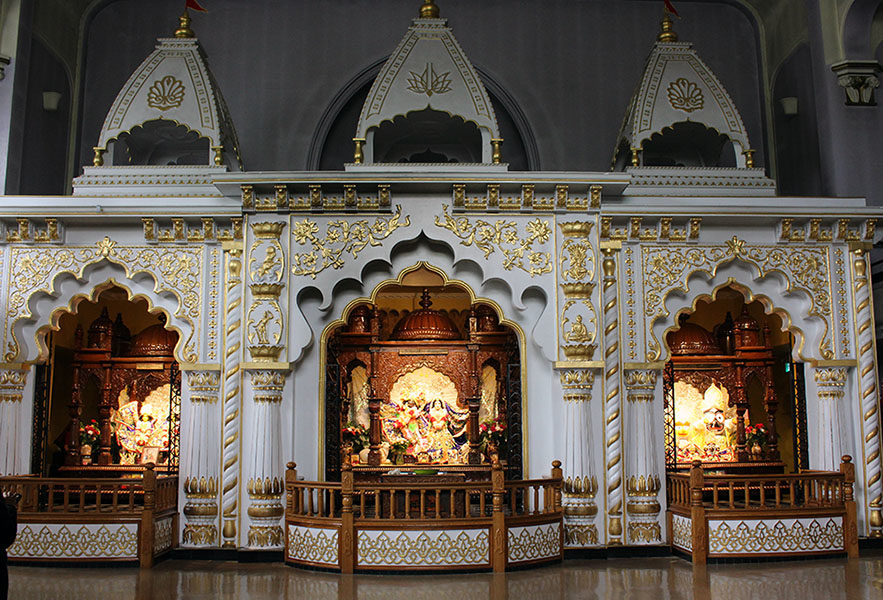 Three altars with Hindu deities at the ISKON Toronto Hindu temple.